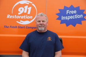 911-restoration-water-damage-mold-remediation-fire-damage-person-van-man